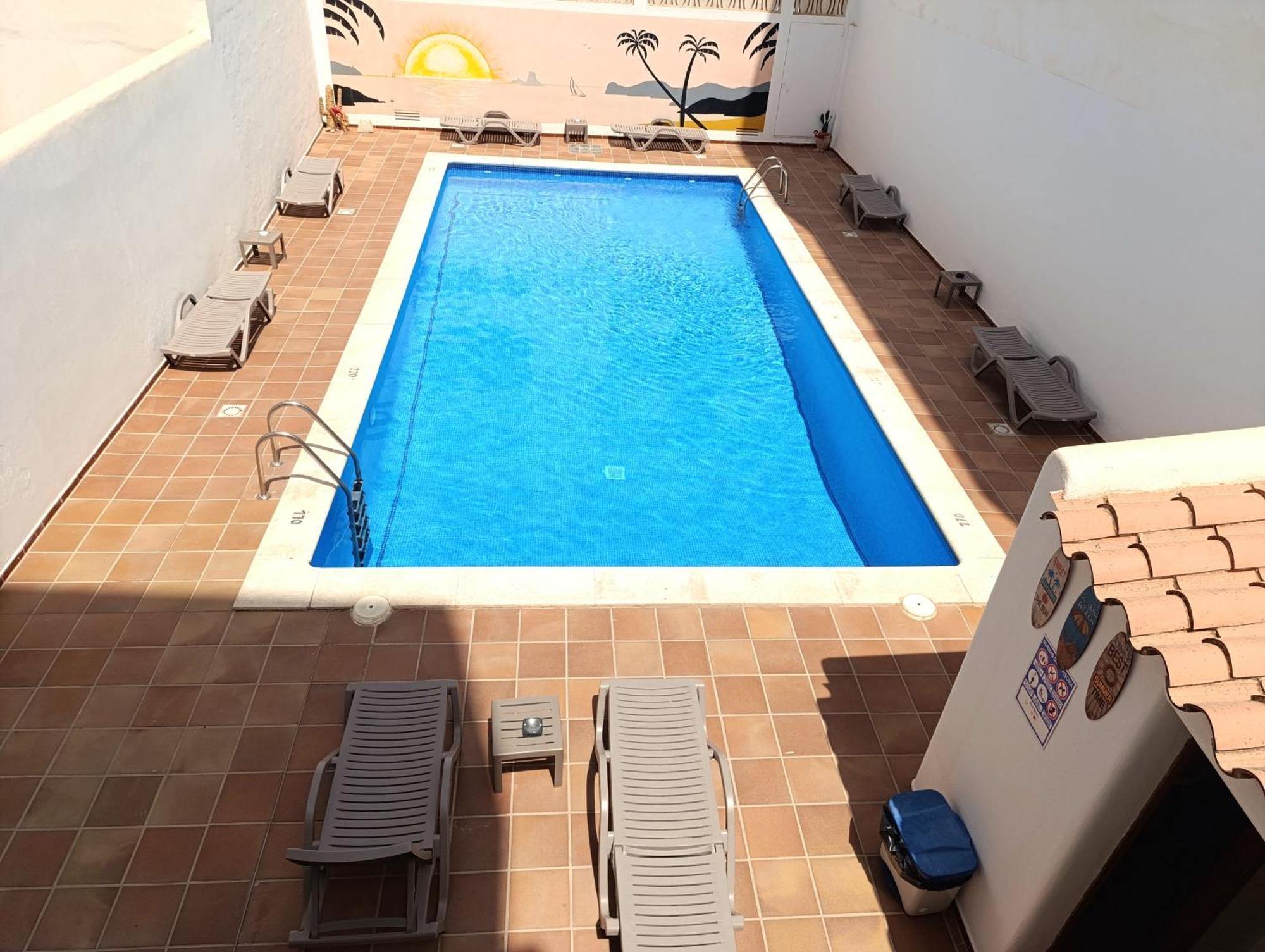 Hostal Horizonte Sant Antoni de Portmany Exterior foto A swimming pool